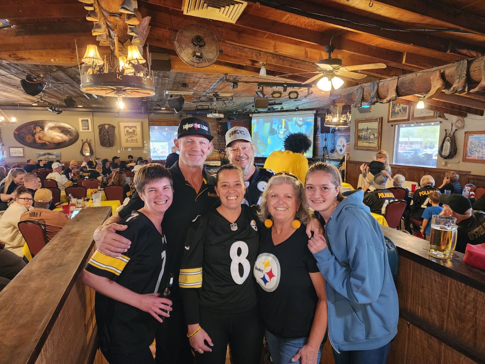 Merril Hoge and winner of Legends of Pittsburgh Cruise at Harold's Corral
